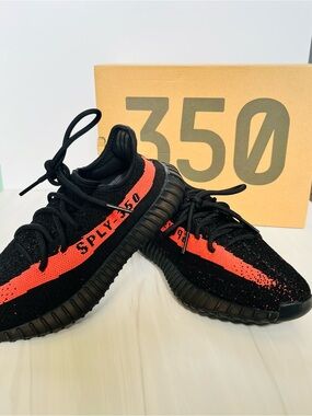 adidas men’s Black Sneakers with Bright Orange Stripe